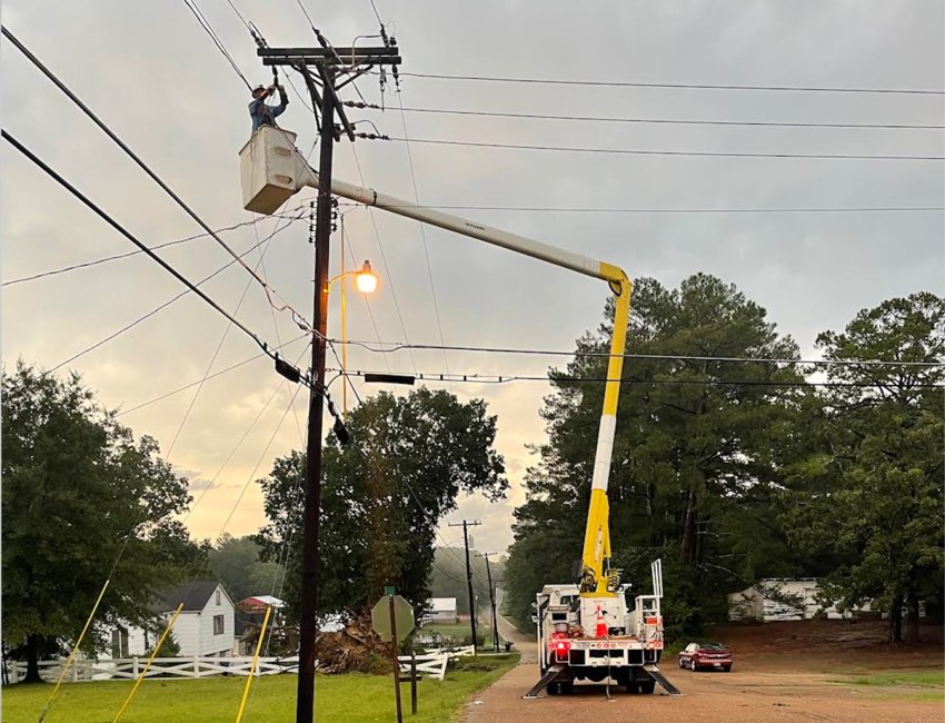 Philadelphia Utilities workers restore power after a Wednesday storm caused power outages.